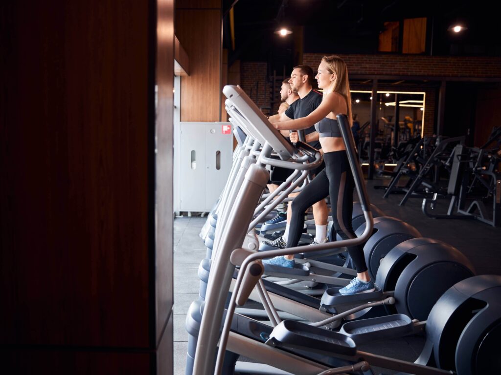 Row of athletes on treadmills
