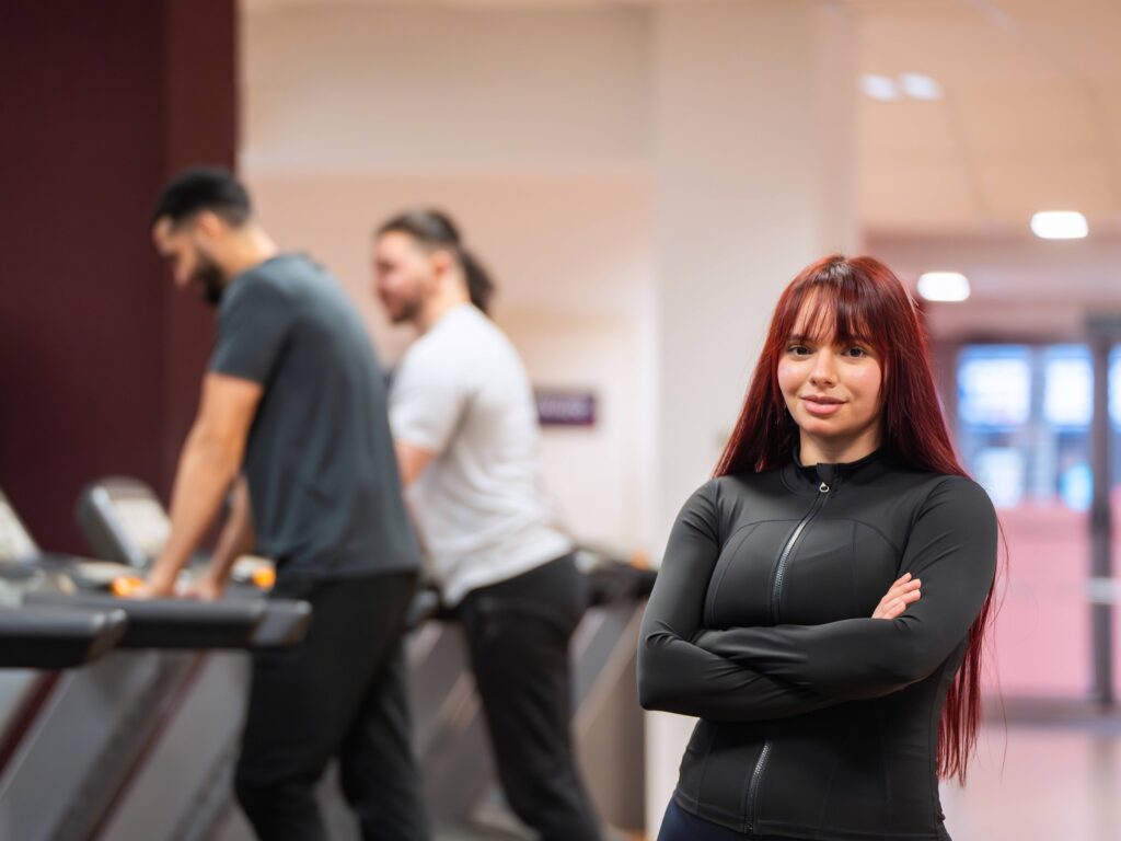 Gym staff member with crossed arms